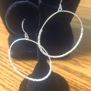Women’s large silver hoop earrings